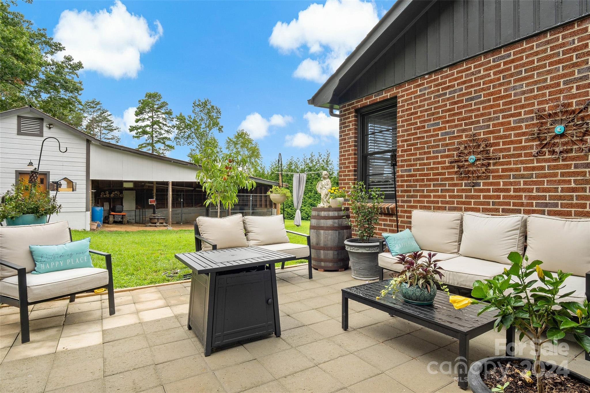 1798 Hopewell Road Morganton, NC 28655 - Photo 3 of 45 a view of a patio with couches and a table and chairs with garden view