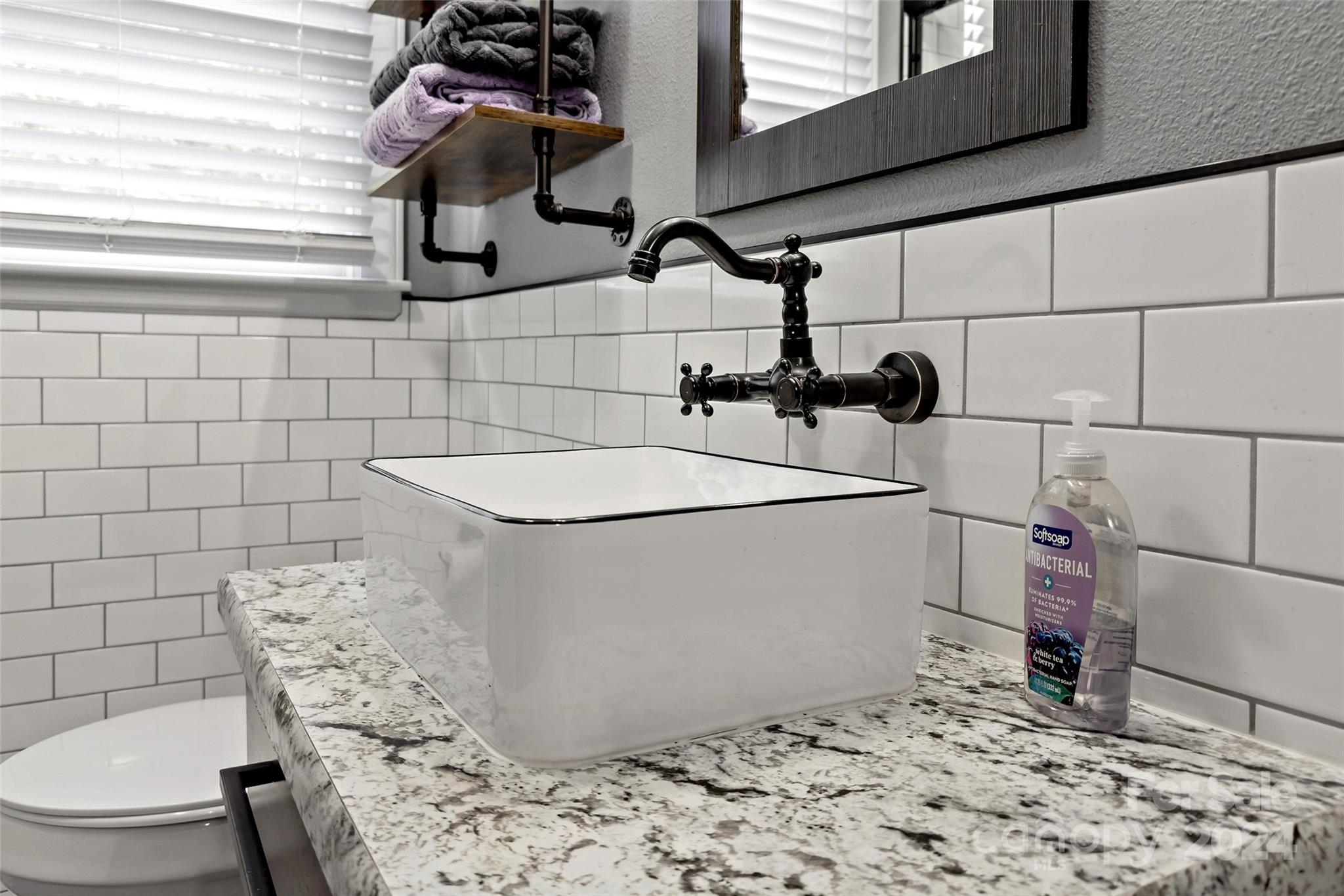 1798 Hopewell Road Morganton, NC 28655 - Photo 33 of 45 a bathroom with a sink toilet and shower