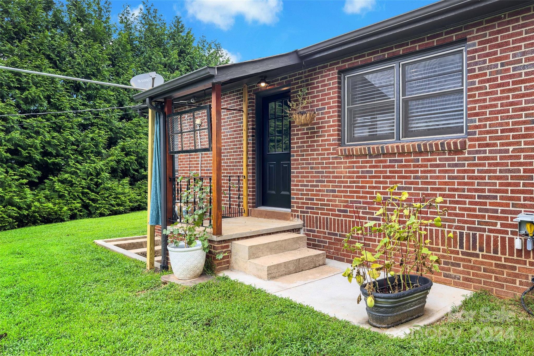 1798 Hopewell Road Morganton, NC 28655 - Photo 43 of 45 a front view of a house with a garden and plants