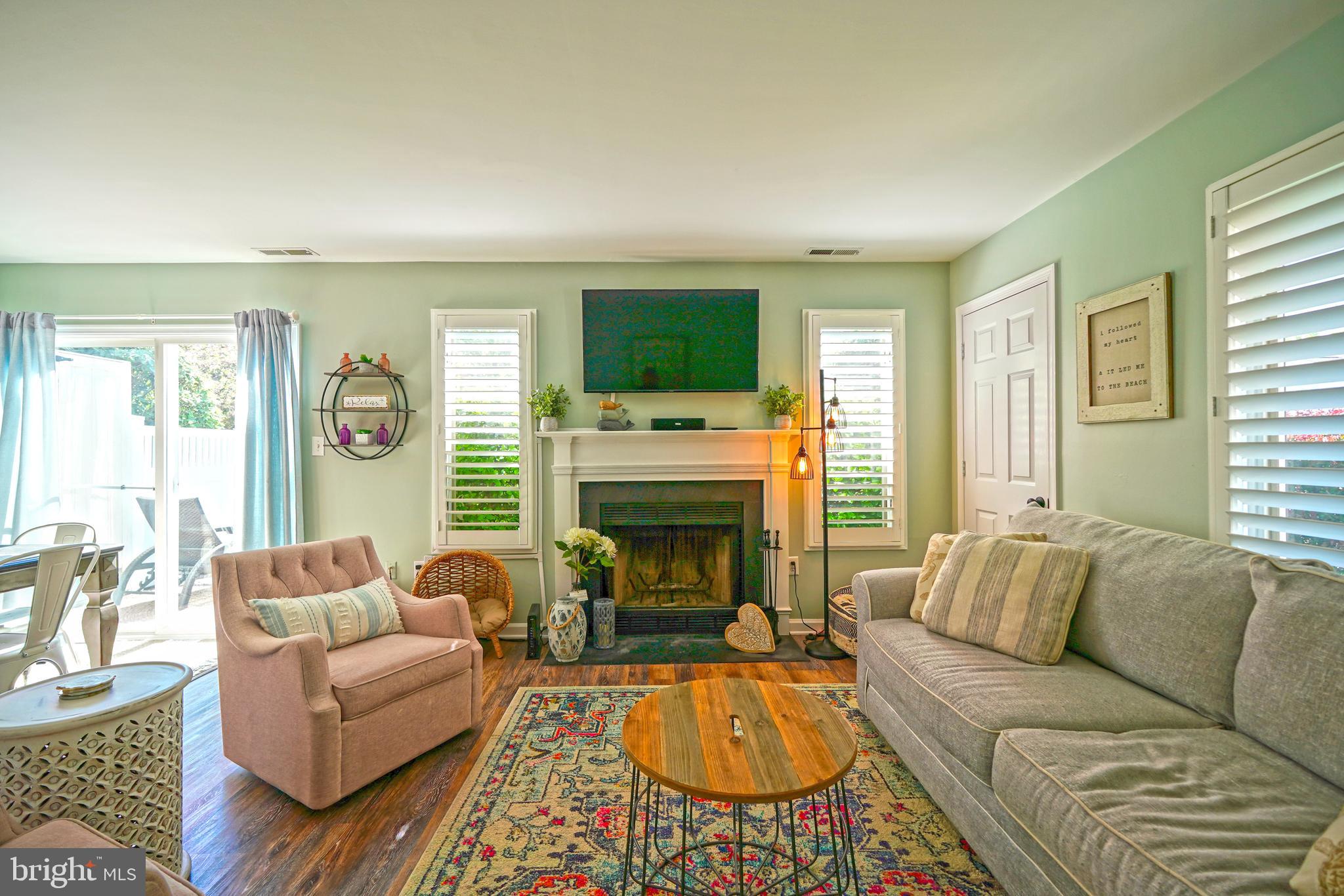 112 Lakeside Drive Lewes, DE 19958 - Photo 7 of 31 a living room with furniture fireplace and window