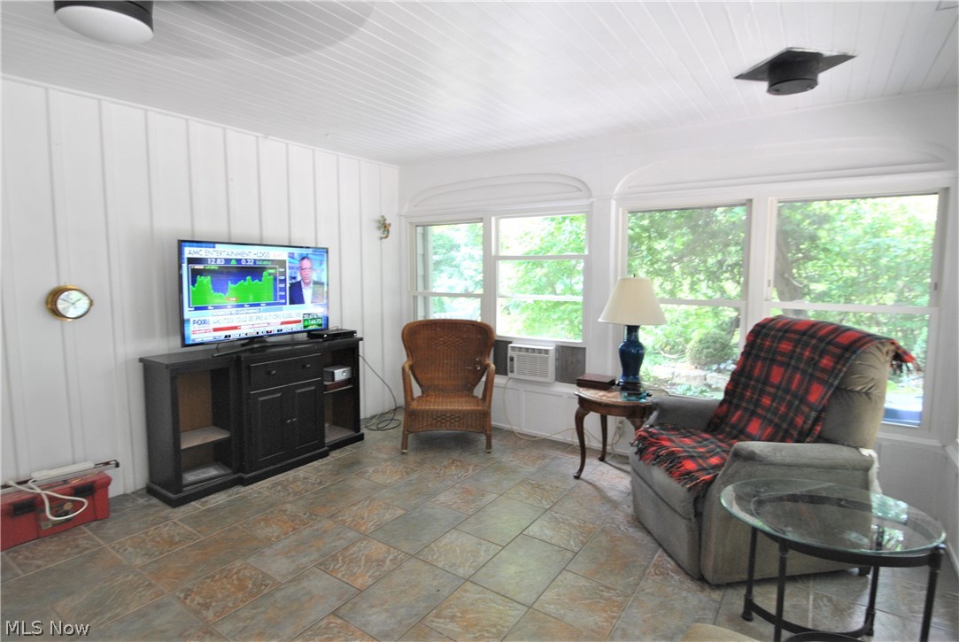 3811 Granger Road Akron, OH 44333 - Photo 16 of 20 Enjoy the 3-season porch with windows on two sides & paneled walls on two sides. Walk-in cedar closet.
Door leading to large brick patio.