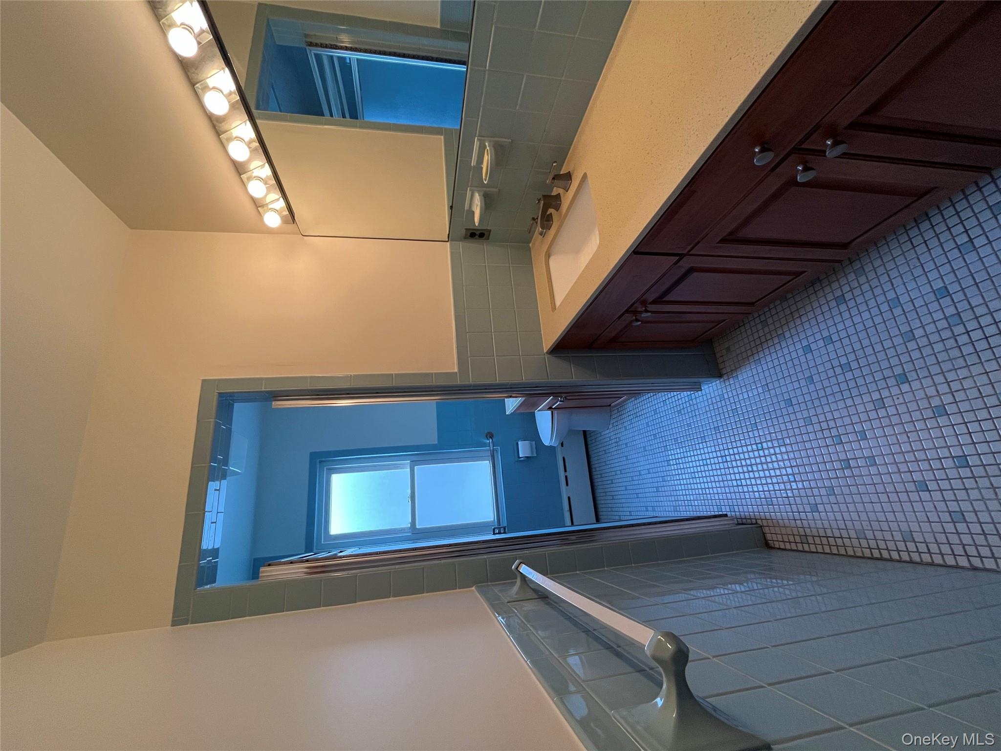 72 Bowman Avenue Rye Brook, NY 10573 - Photo 16 of 18 Oversized bathroom with separate vanity area.