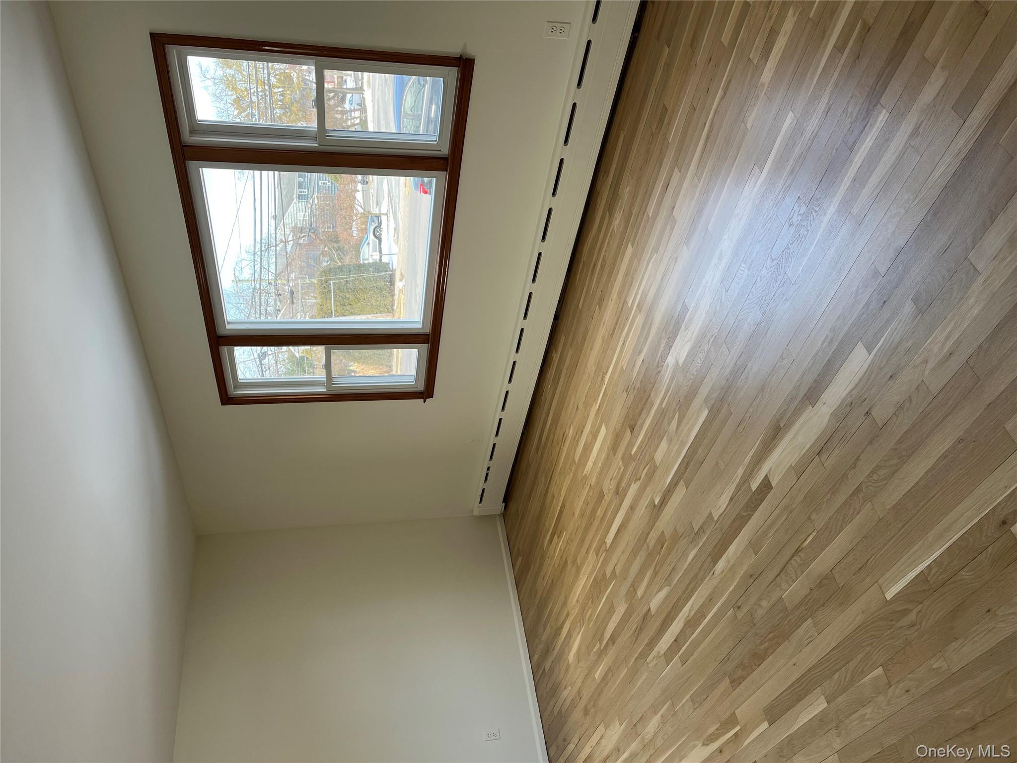 72 Bowman Avenue Rye Brook, NY 10573 - Photo 2 of 18 Another view of the living room with oversized window facing the front of the house.