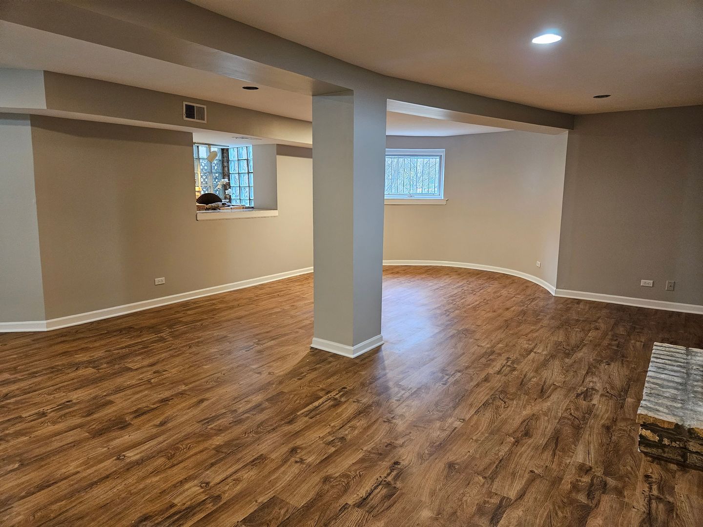4012 North Sheridan Road, Unit GN Chicago, IL 60613 - Photo 5 of 13 a view of an empty room with wooden floor and a window