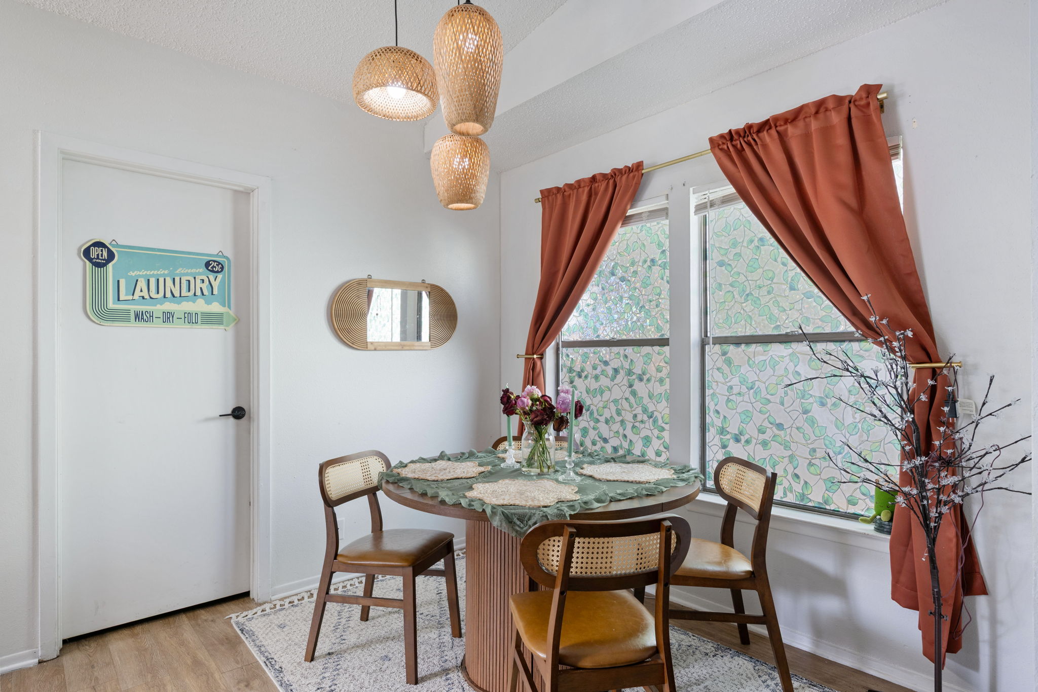 8317 Forest Ridge Drive San Antonio, TX 78239 - Photo 7 of 26 Natural light illuminates this cozy dining area, featuring a decorative door and elegant lighting fixtures.