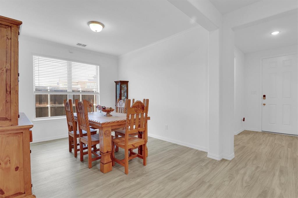 1446 Whitewater Drive Little Elm, TX 75068 - Photo 11 of 35 a view of a dining room with furniture window and outside view