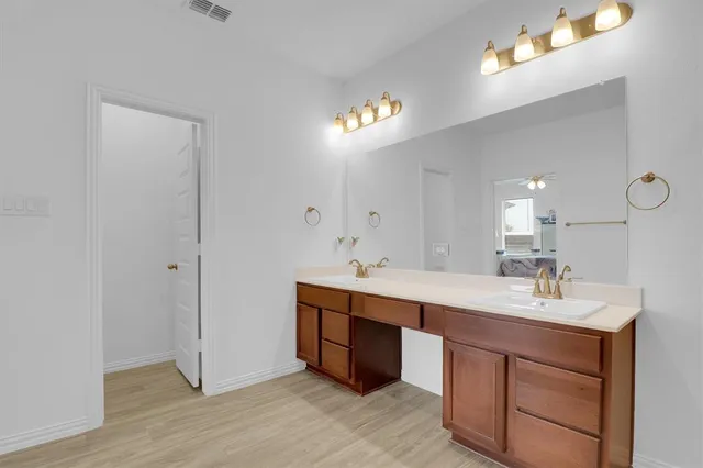 a bathroom with a sink toilet and vanity