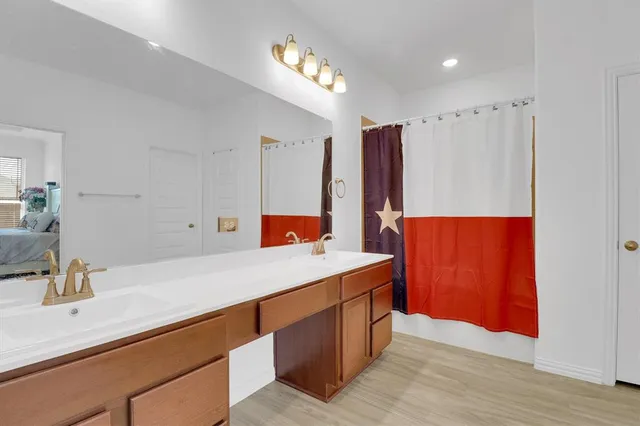a very nice looking room with a wooden floor and a sink