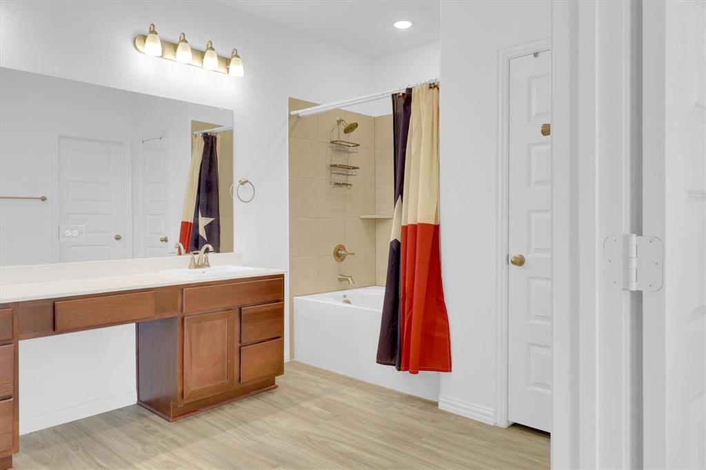 1446 Whitewater Drive Little Elm, TX 75068 - Photo 32 of 35 a very nice looking room with a wooden floor and a sink