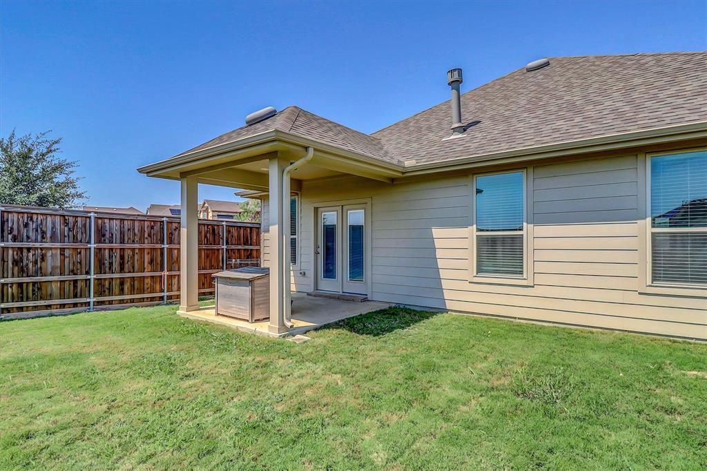 1446 Whitewater Drive Little Elm, TX 75068 - Photo 34 of 35 a view of a house with a yard and sitting area