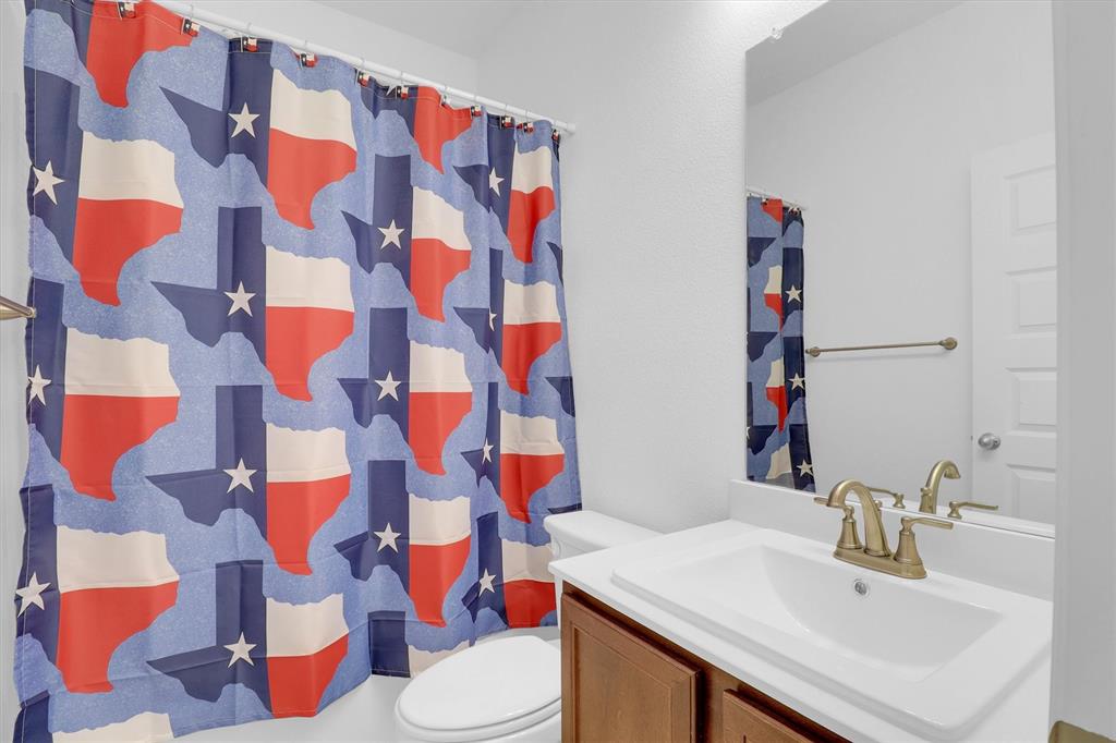 1446 Whitewater Drive Little Elm, TX 75068 - Photo 8 of 35 a bathroom with a sink and toilet