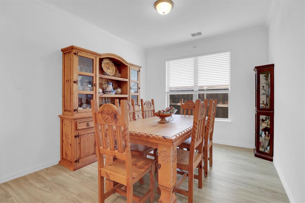 1446 Whitewater Drive Little Elm, TX 75068 - Photo 10 of 35 a view of a dining room with furniture and window