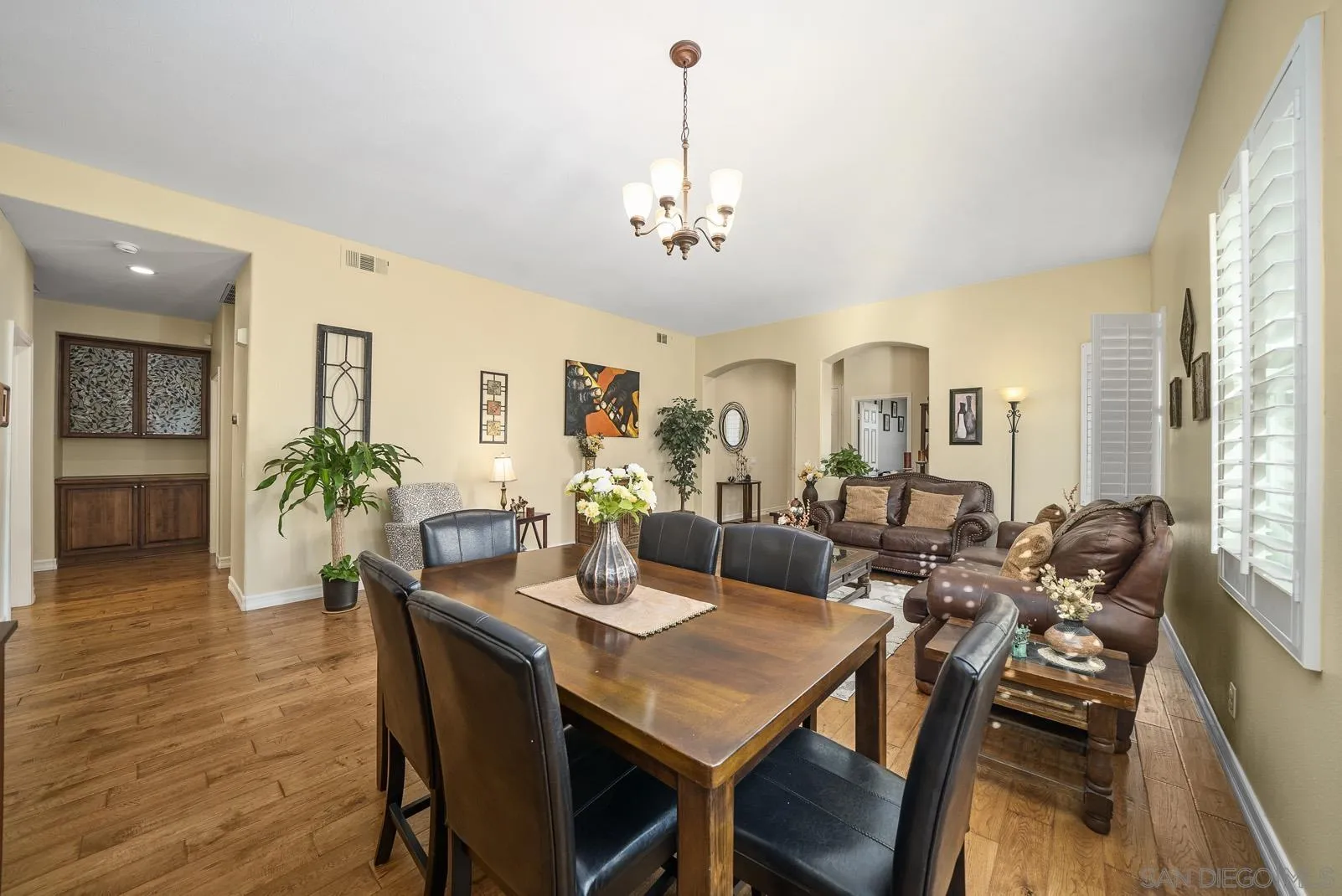 41453 Temeku Drive Temecula, CA 92591 - Photo 12 of 34 a view of a dining room with furniture window and wooden floor