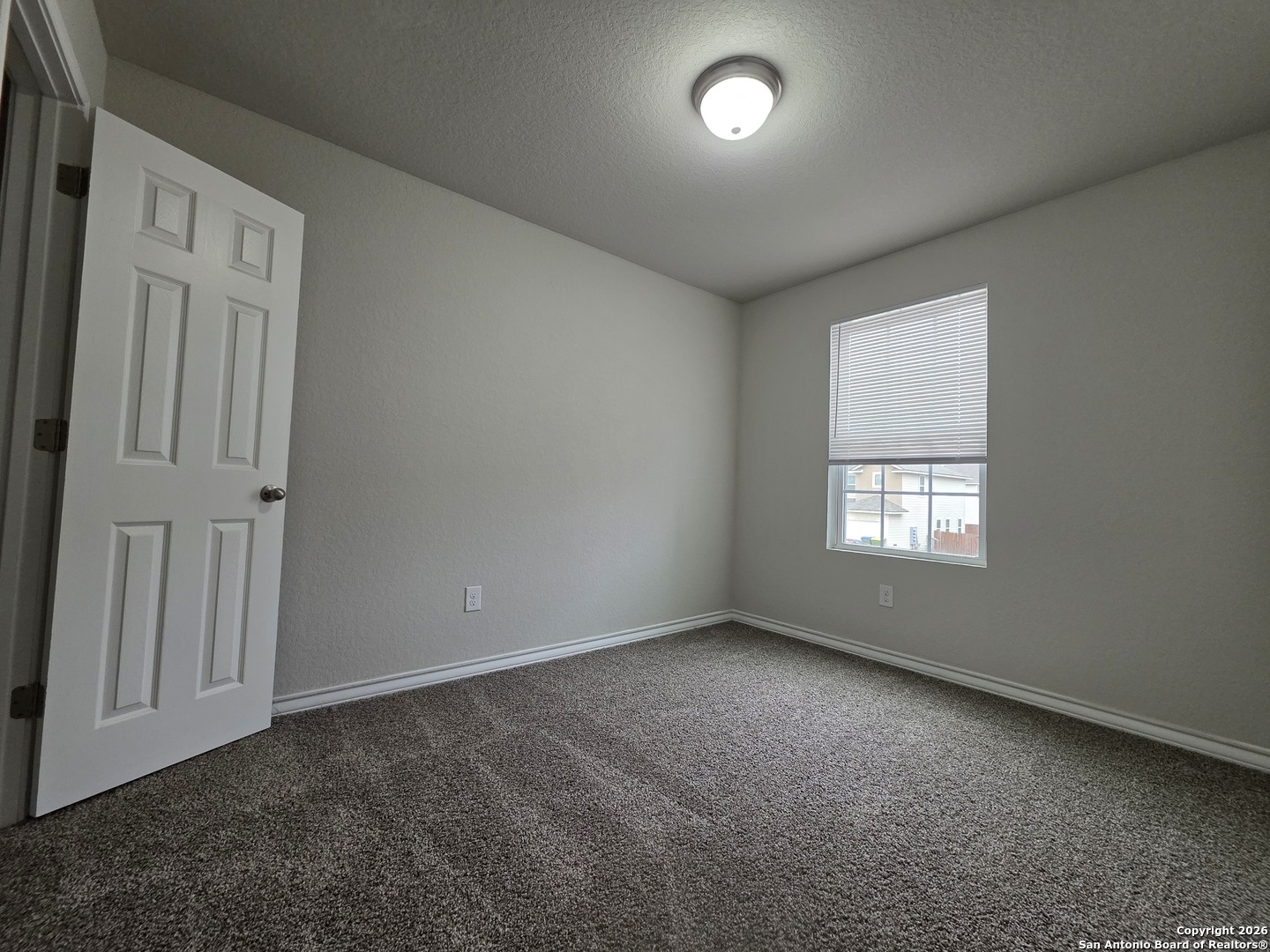 16909 Dancing Ava, Unit 2 Selma, TX 78154 - Photo 12 of 22 an empty room with a empty space and windows