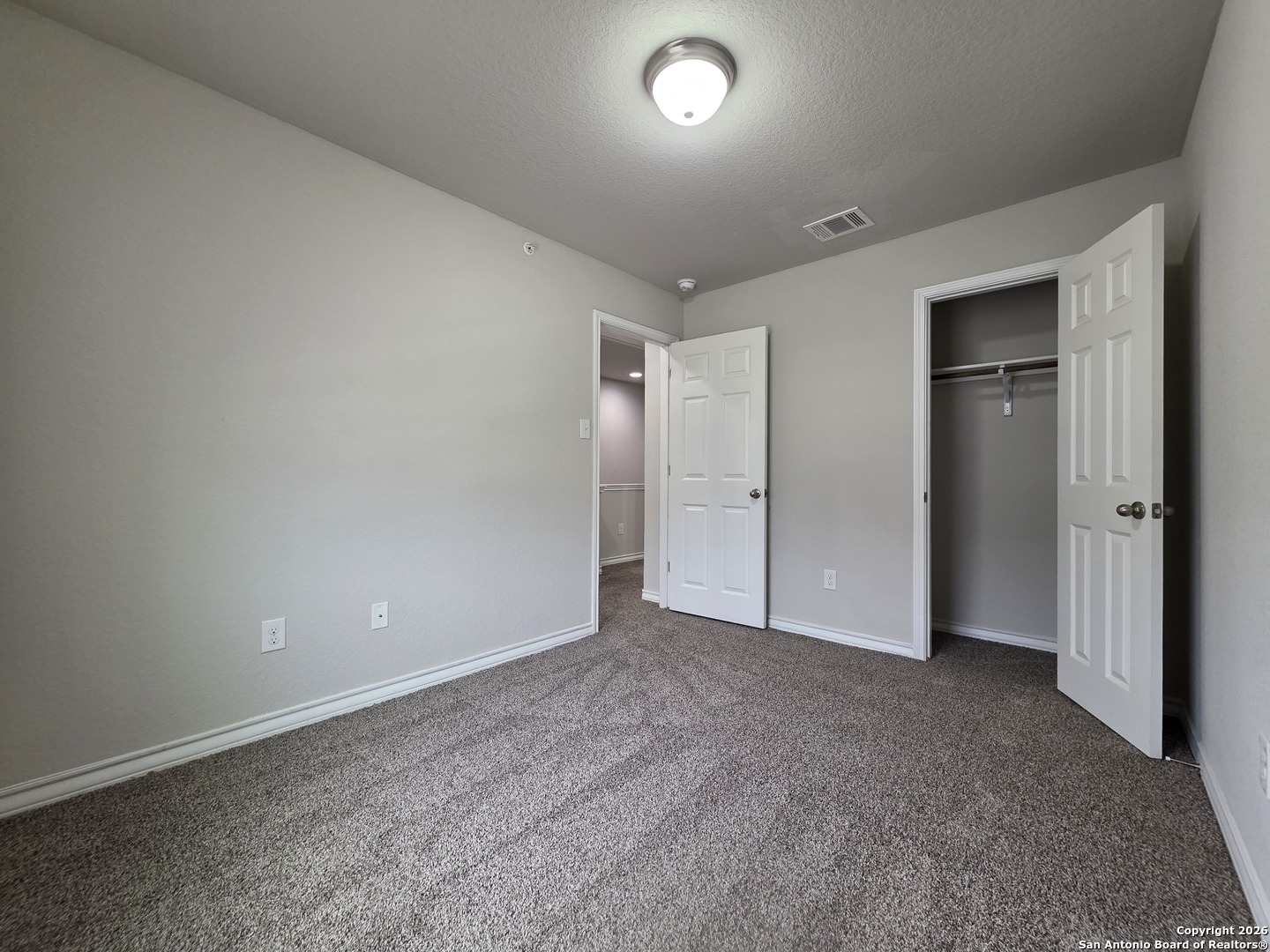 16909 Dancing Ava, Unit 2 Selma, TX 78154 - Photo 13 of 22 an empty room with closet and a bathroom
