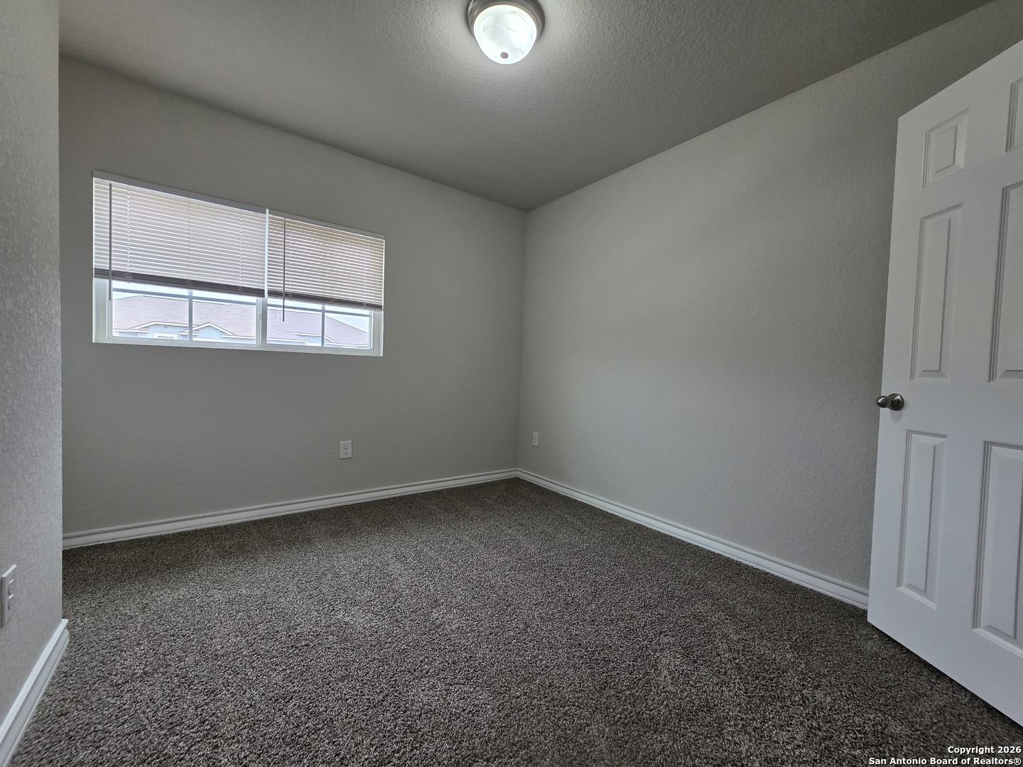 16909 Dancing Ava, Unit 2 Selma, TX 78154 - Photo 15 of 22 an empty room with a window