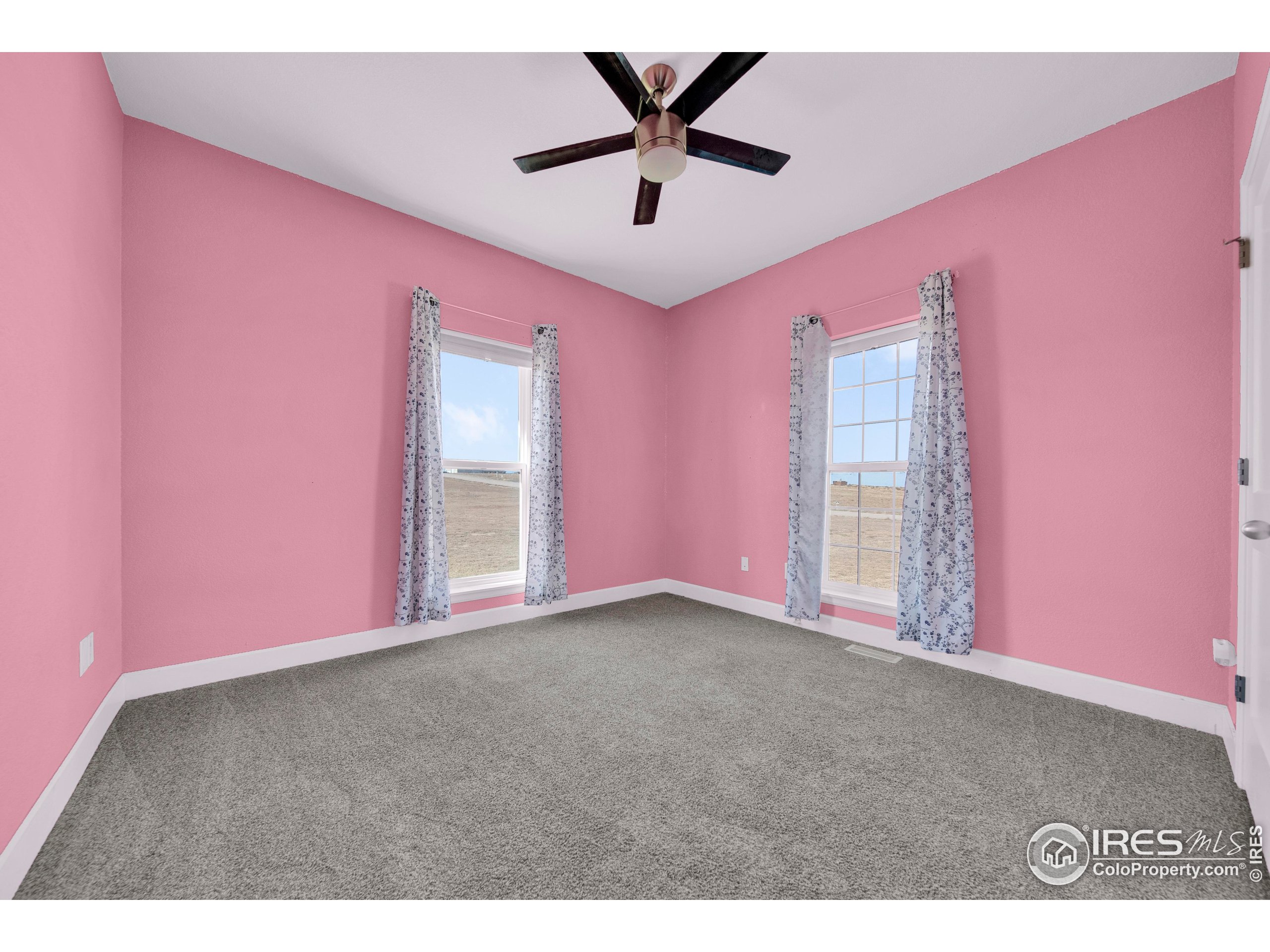 7566 County Road Wiggins, CO 80654 - Photo 16 of 23 a view of an empty room with a window