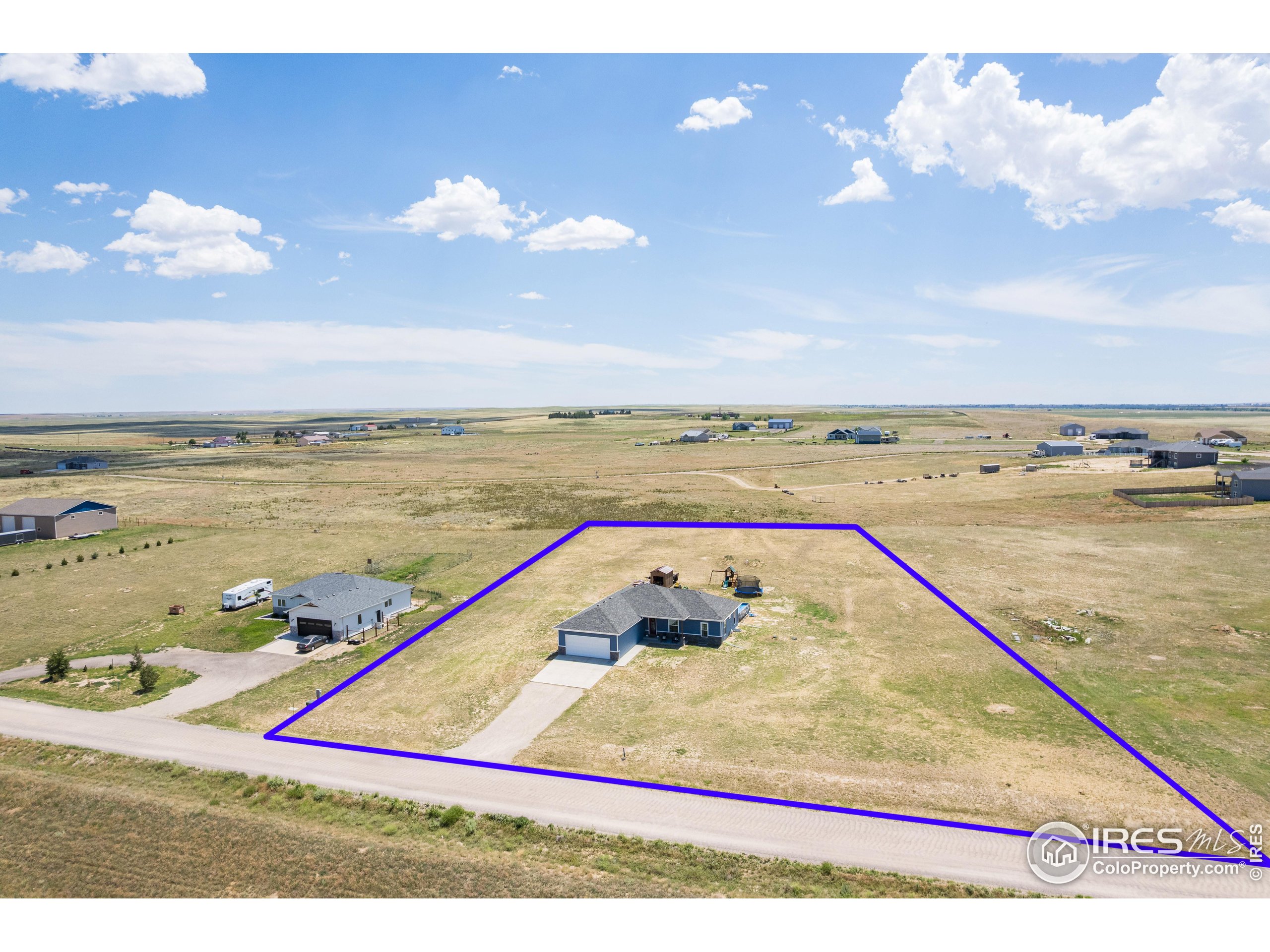 7566 County Road Wiggins, CO 80654 - Photo 21 of 23 a view of an ocean and beach