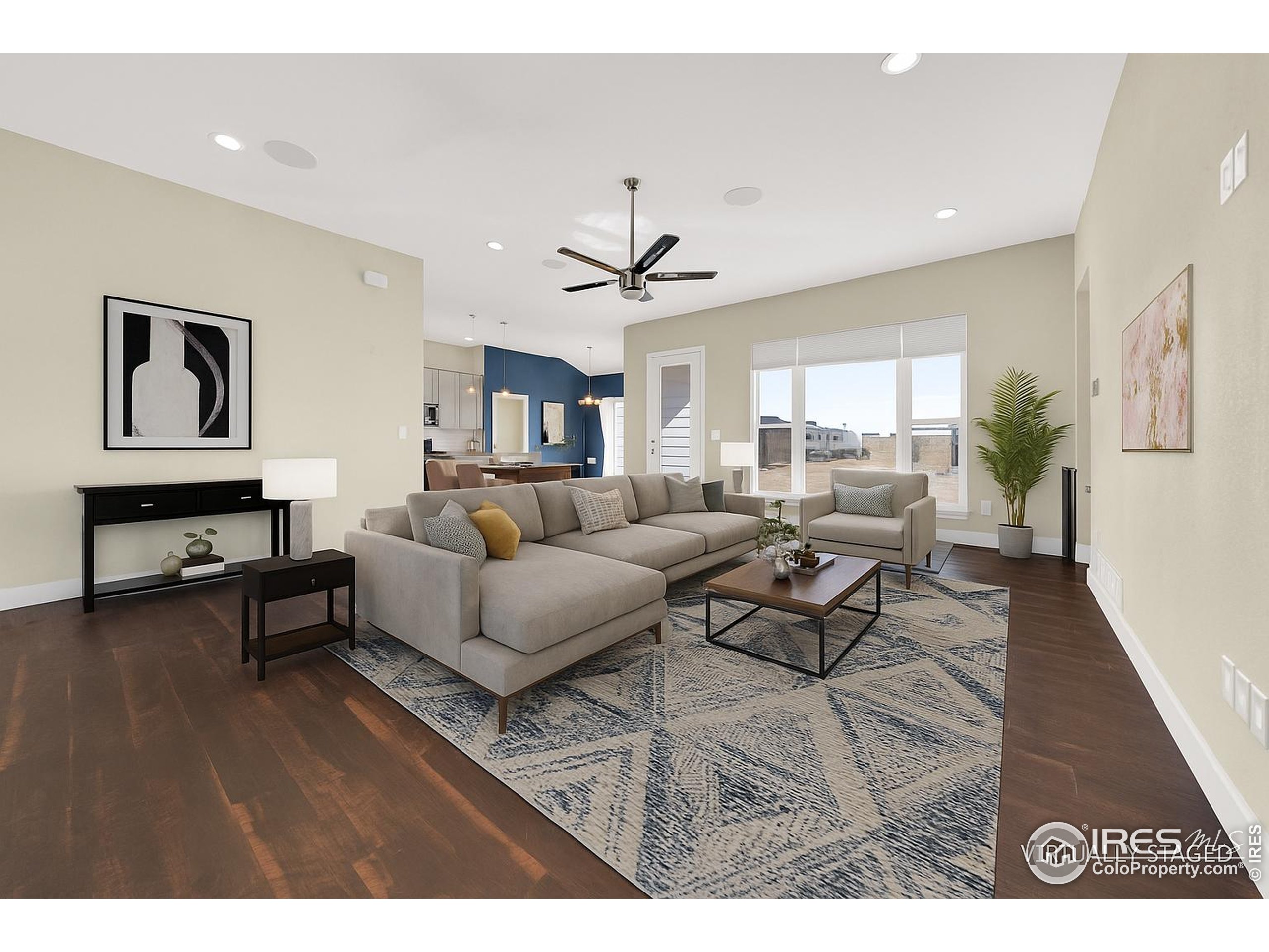 7566 County Road Wiggins, CO 80654 - Photo 3 of 23 a living room with furniture and wooden floor