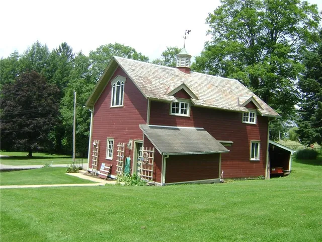 a living room with furniture and a lamp