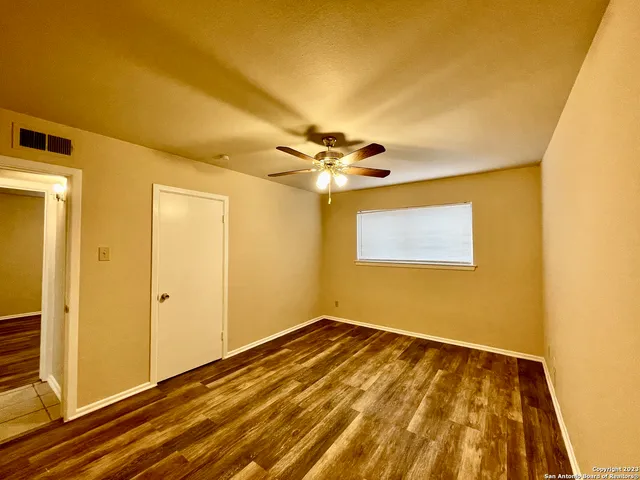 a view of a room with a hanging light