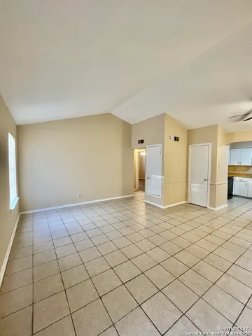 a kitchen with cabinets and stainless steel appliances