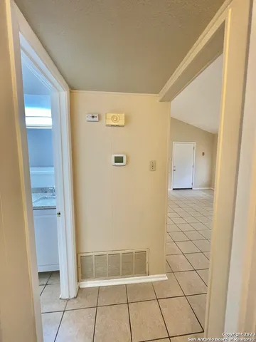 a kitchen with granite countertop a sink and a stove
