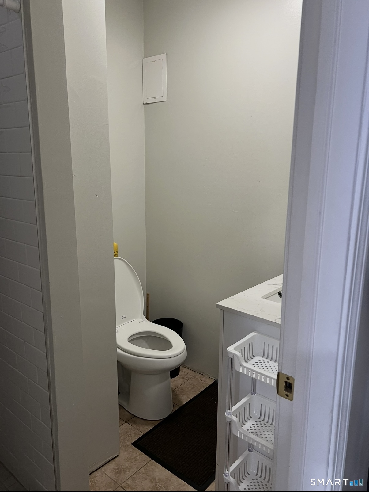 391 Coleman Street Bridgeport, CT 06604 - Photo 13 of 13 a white toilet sitting next to a shower