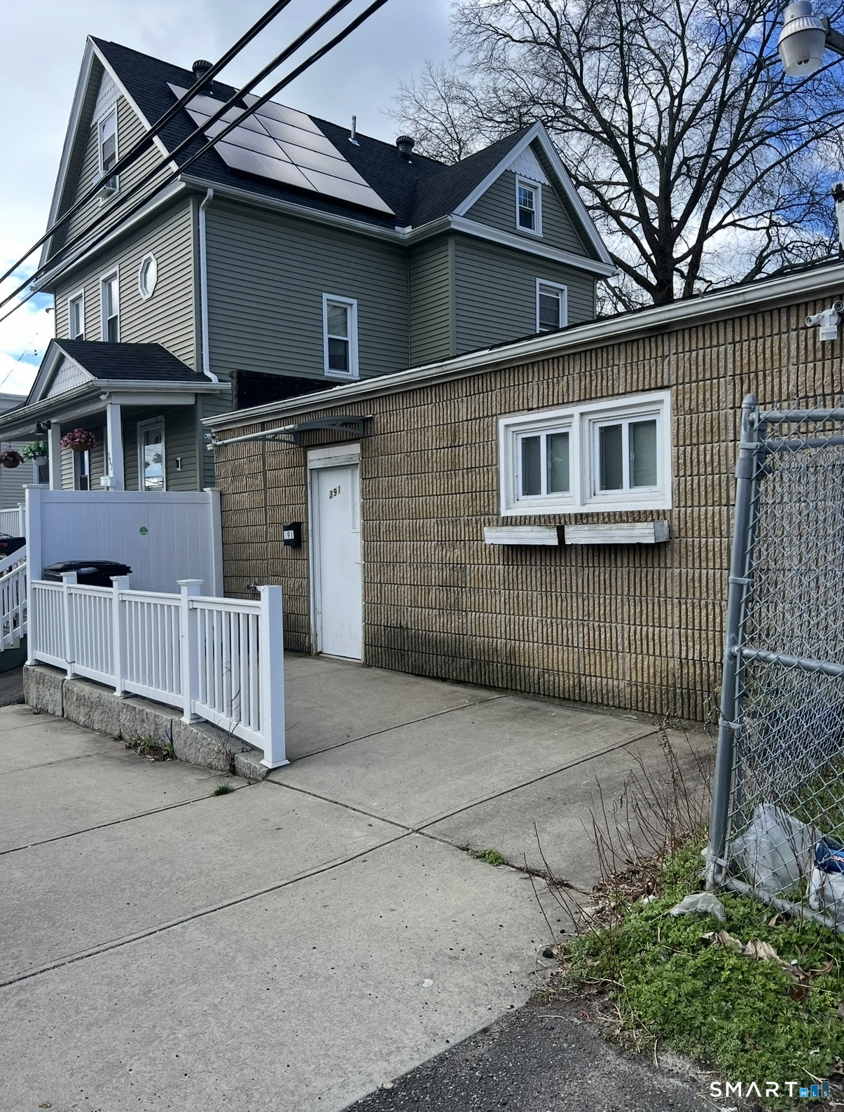 391 Coleman Street Bridgeport, CT 06604 - Photo 8 of 13 a front view of a house with a garage
