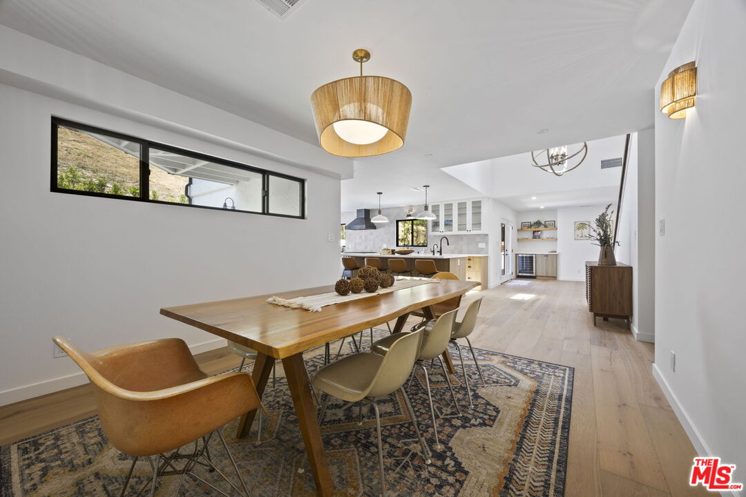 1131 Rancho Drive Ojai, CA 93023 - Photo 17 of 58 a view of a dining room with furniture and a chandelier