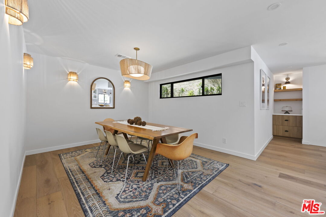 1131 Rancho Drive Ojai, CA 93023 - Photo 18 of 58 a view of a dining room with furniture and wooden floor