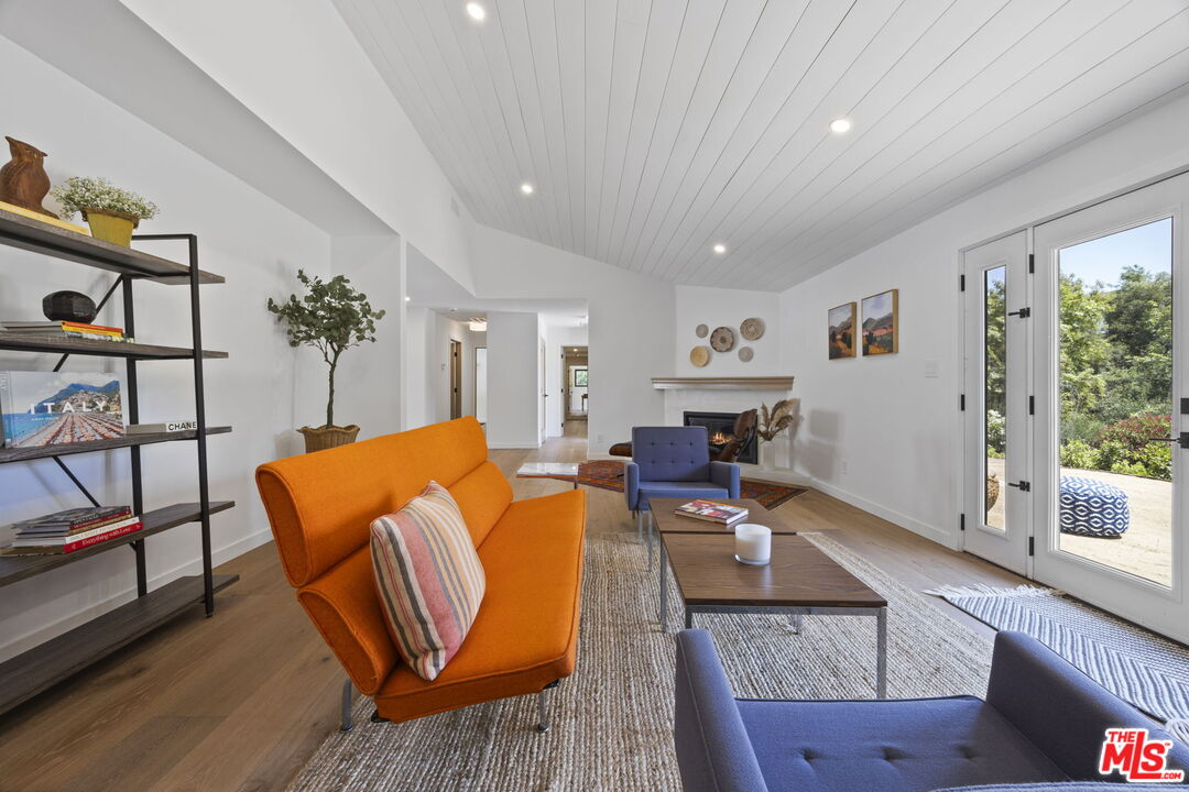 1131 Rancho Drive Ojai, CA 93023 - Photo 21 of 58 a living room with furniture a dining table and a potted plant