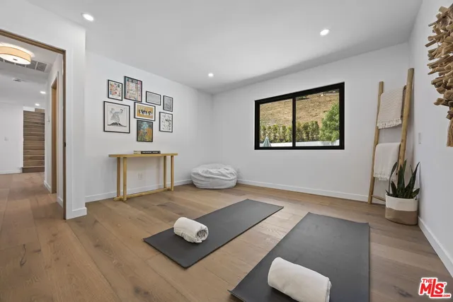 a bedroom with furniture and a fireplace