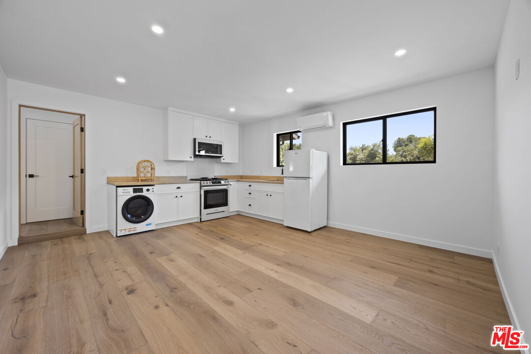1131 Rancho Drive Ojai, CA 93023 - Photo 46 of 58 a view of a kitchen with a sink and a refrigerator