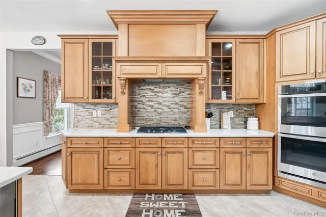 a dining room with furniture a chandelier and wooden floor
