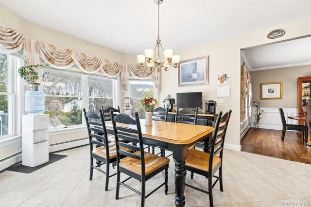 a bathroom with a granite countertop sink a toilet a shower and a mirror
