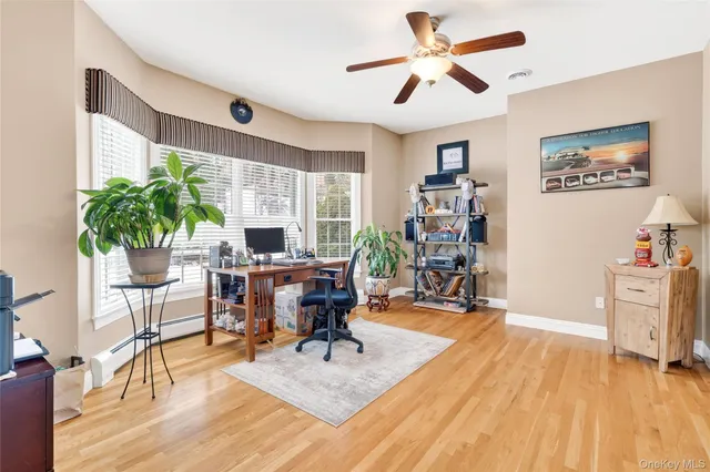 a bathroom with a sink mirror and toilet