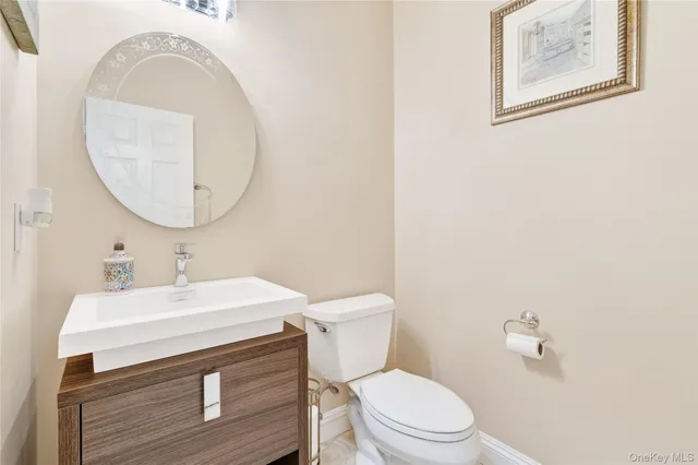 a spacious bedroom with a bed and a chandelier