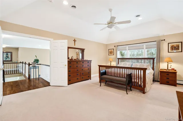 a living room with a large window and walk in closet