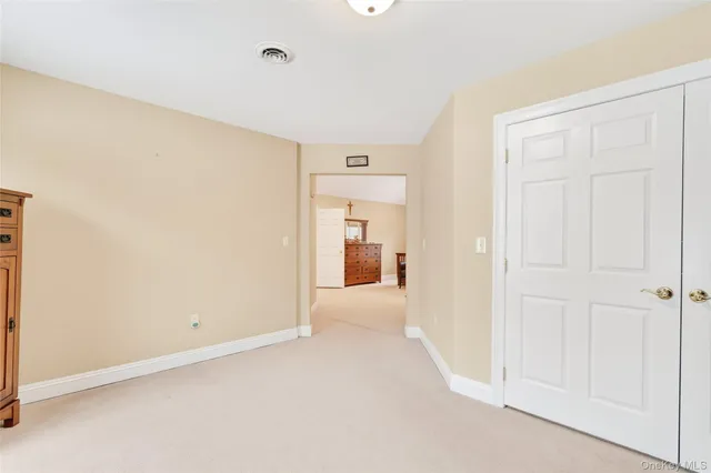 a bathroom with double sink and a mirror