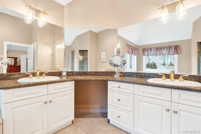 a bedroom with a bed and a lamp