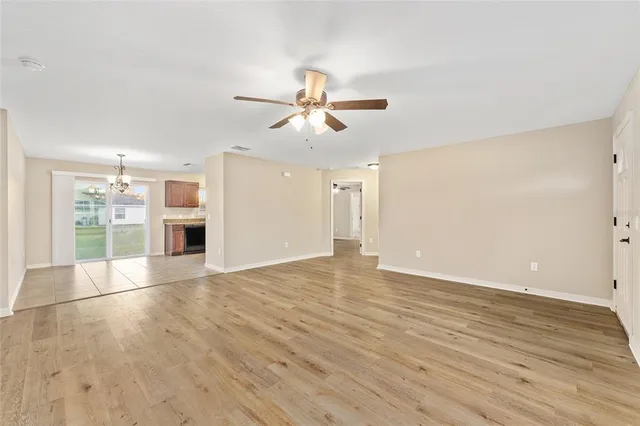 a view of a kitchen with a sink and a kitchen island