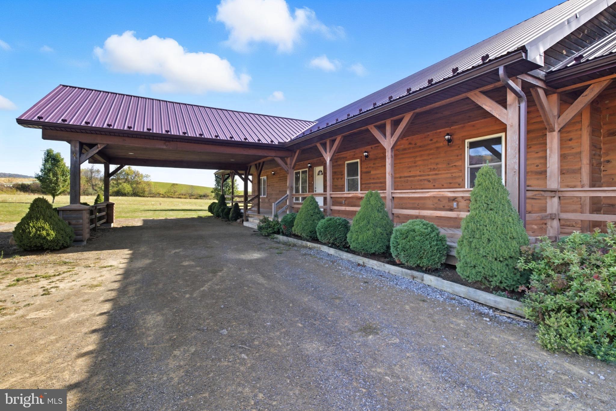107 Linkin Park Drive Spring Mills, PA 16875 - Photo 15 of 66 a view of a house with porch and wooden floor