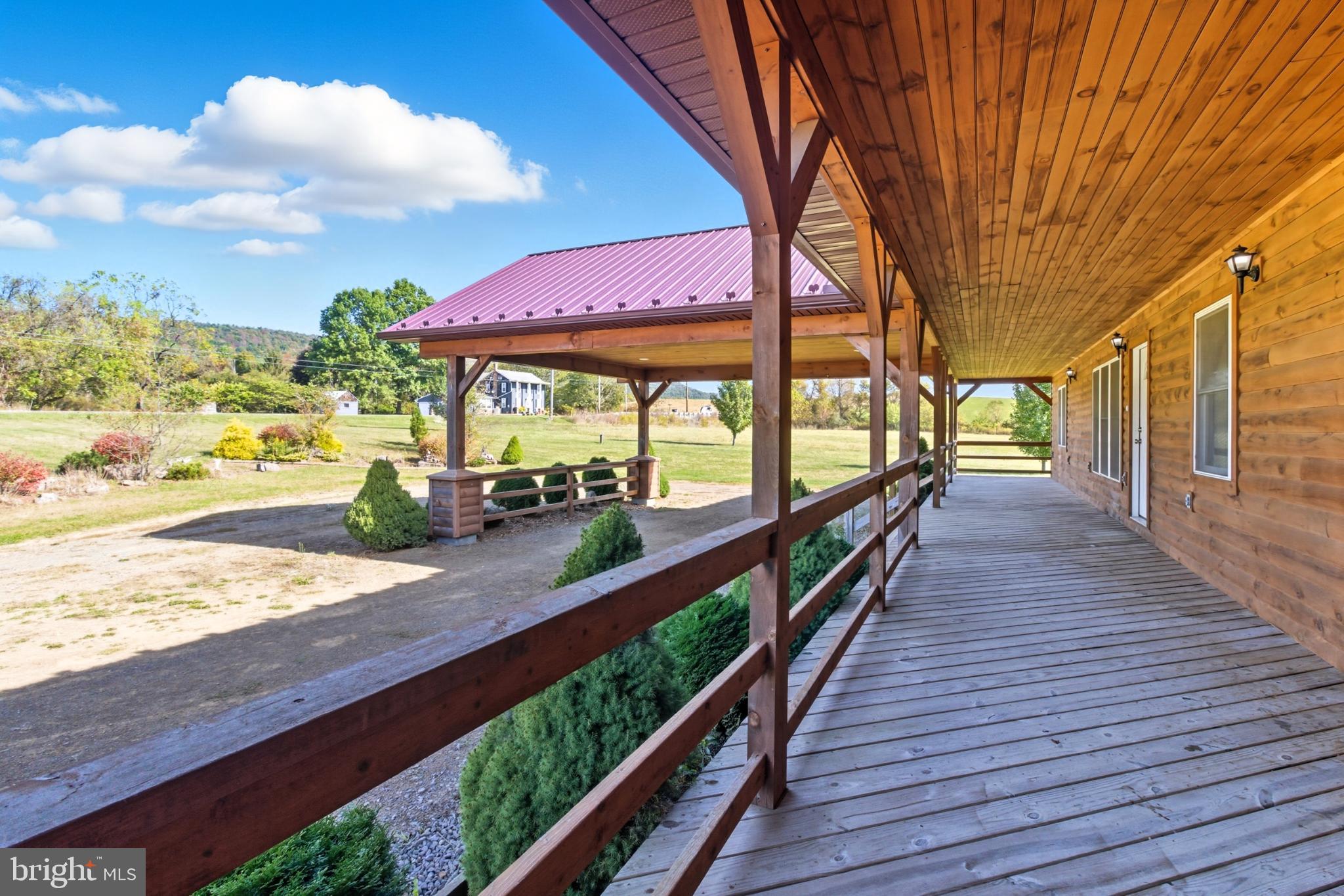 107 Linkin Park Drive Spring Mills, PA 16875 - Photo 16 of 66 Charming porch with scenic countryside views.