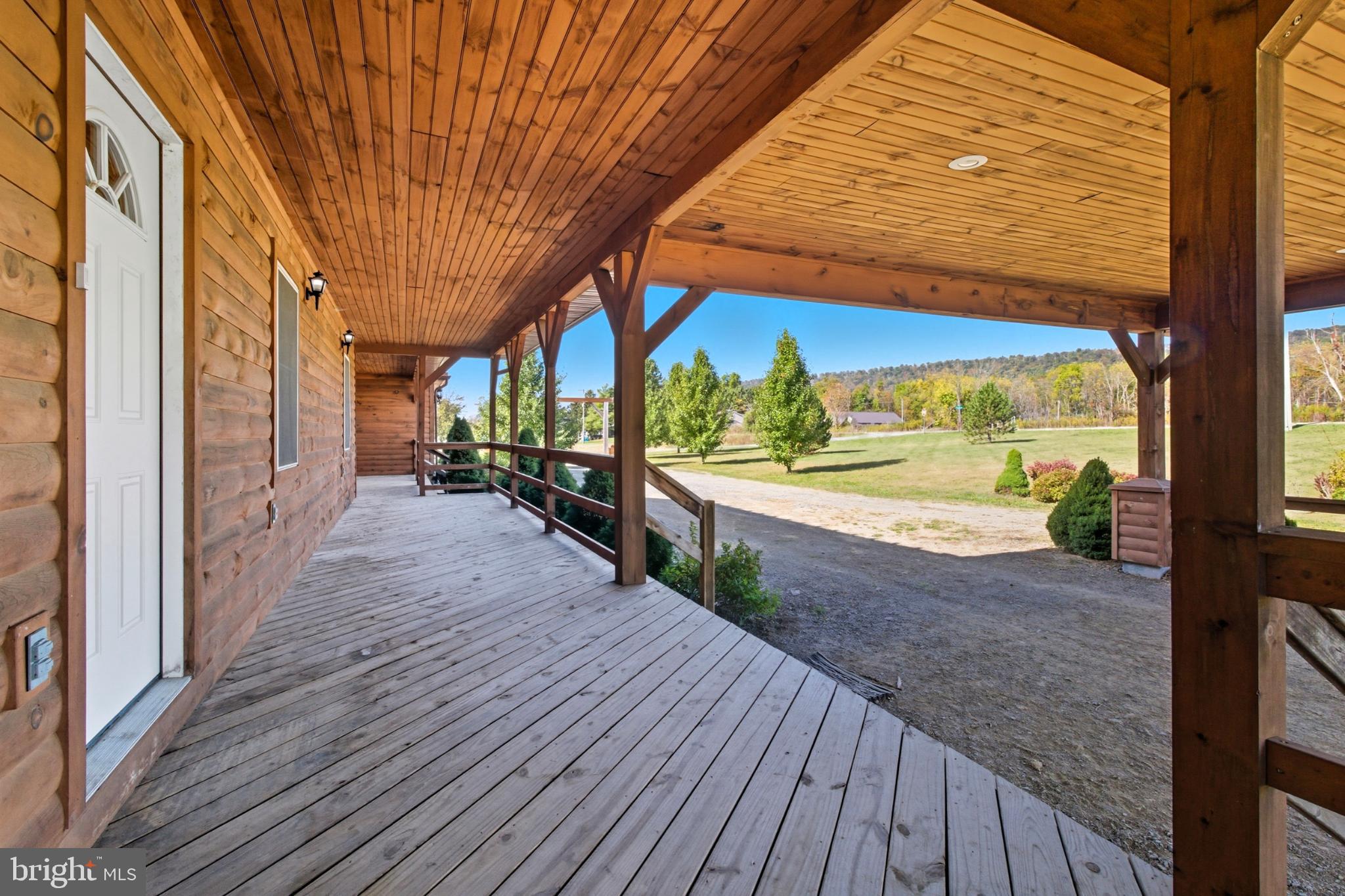 107 Linkin Park Drive Spring Mills, PA 16875 - Photo 17 of 66 Inviting porch with scenic countryside views.