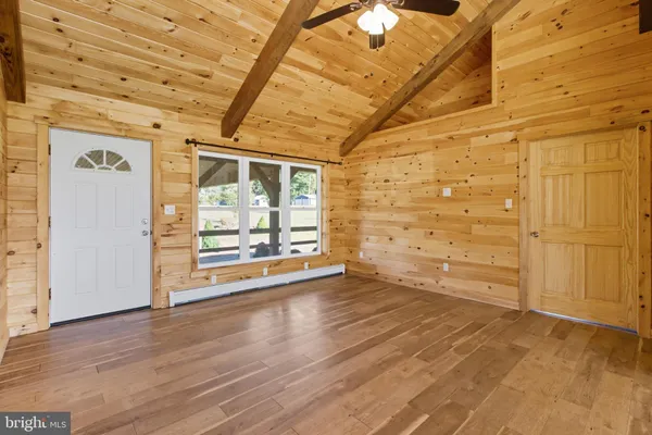 a view of an empty room with a window