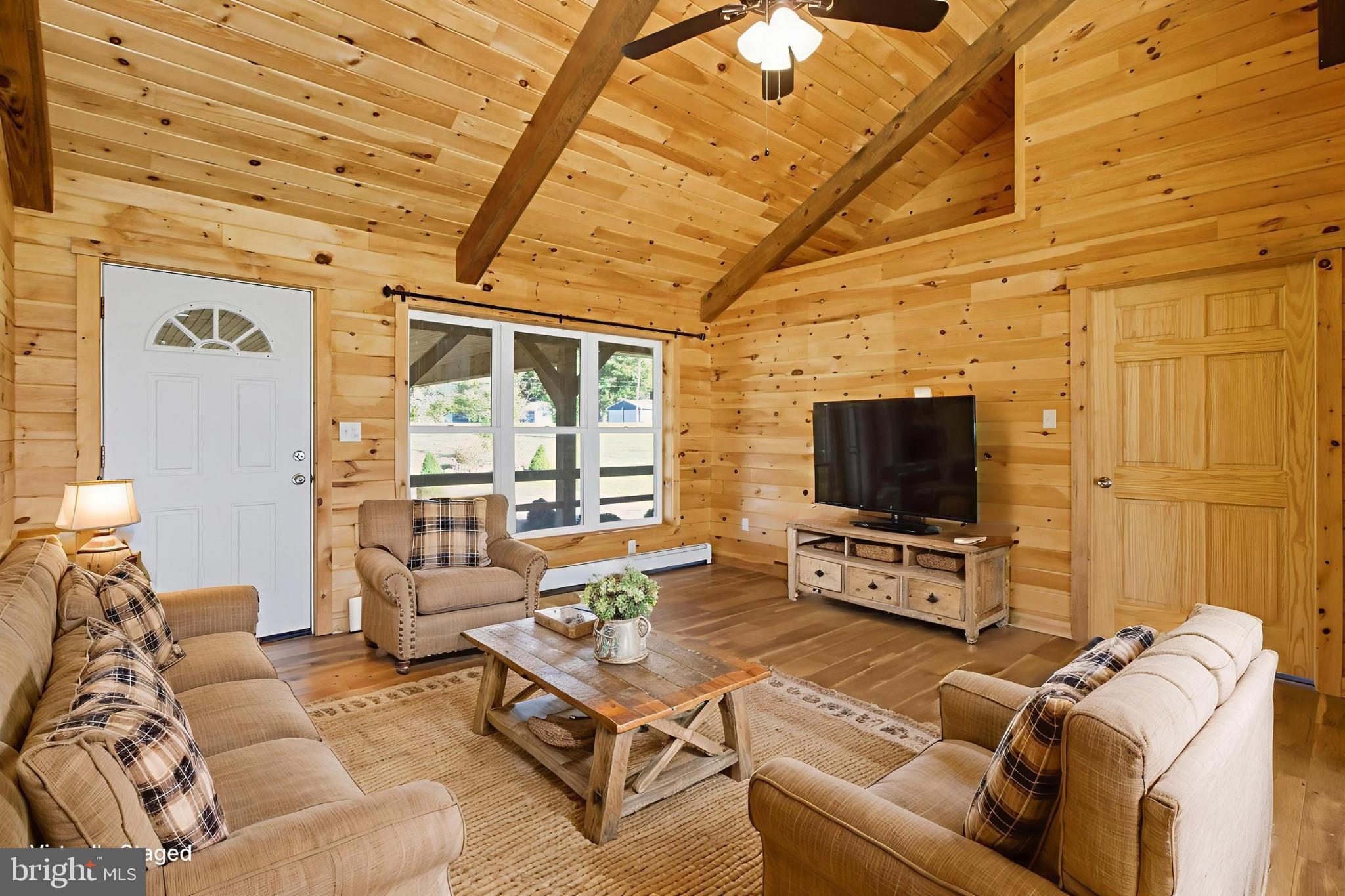 107 Linkin Park Drive Spring Mills, PA 16875 - Photo 2 of 66 a living room with furniture and a flat screen tv
