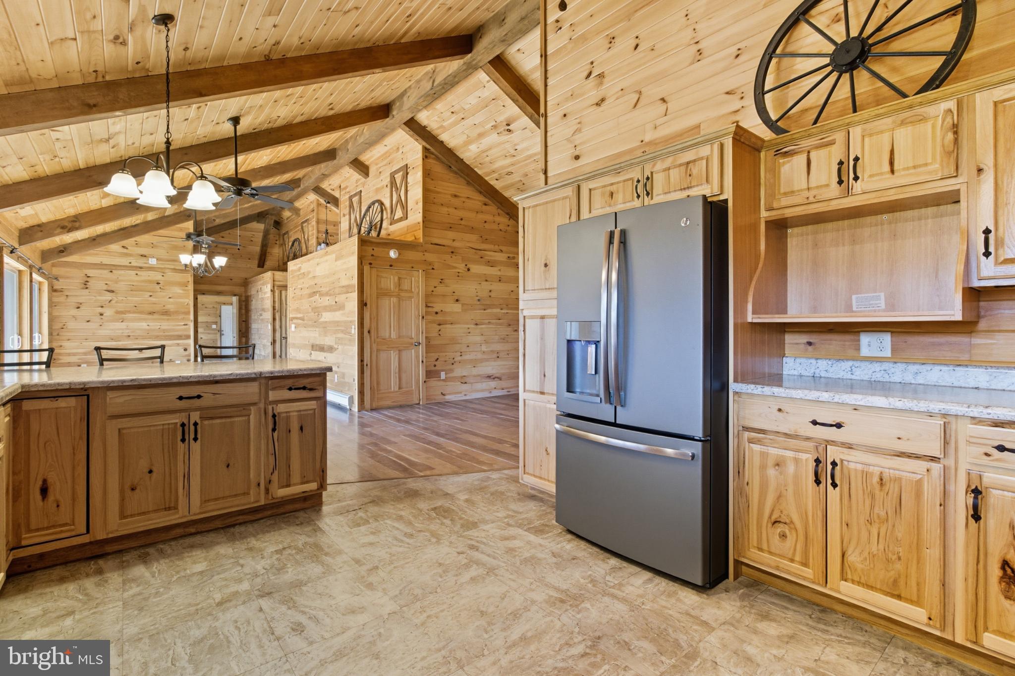 107 Linkin Park Drive Spring Mills, PA 16875 - Photo 25 of 66 a kitchen with stainless steel appliances granite countertop a refrigerator and a sink