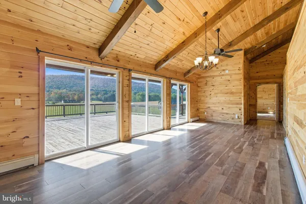 a view of a ceiling fan and wooden floor