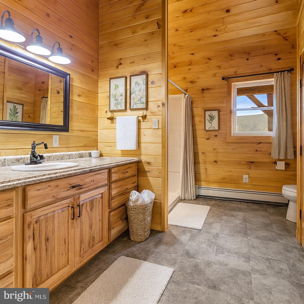 107 Linkin Park Drive Spring Mills, PA 16875 - Photo 31 of 66 a spacious bathroom with a sink a mirror and a shower